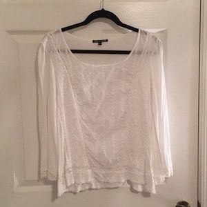 Sheer long sleeve white blouse with lace detail.